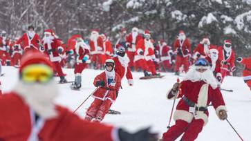 Santas skiing at Sunday River Resort during Santa Sunday