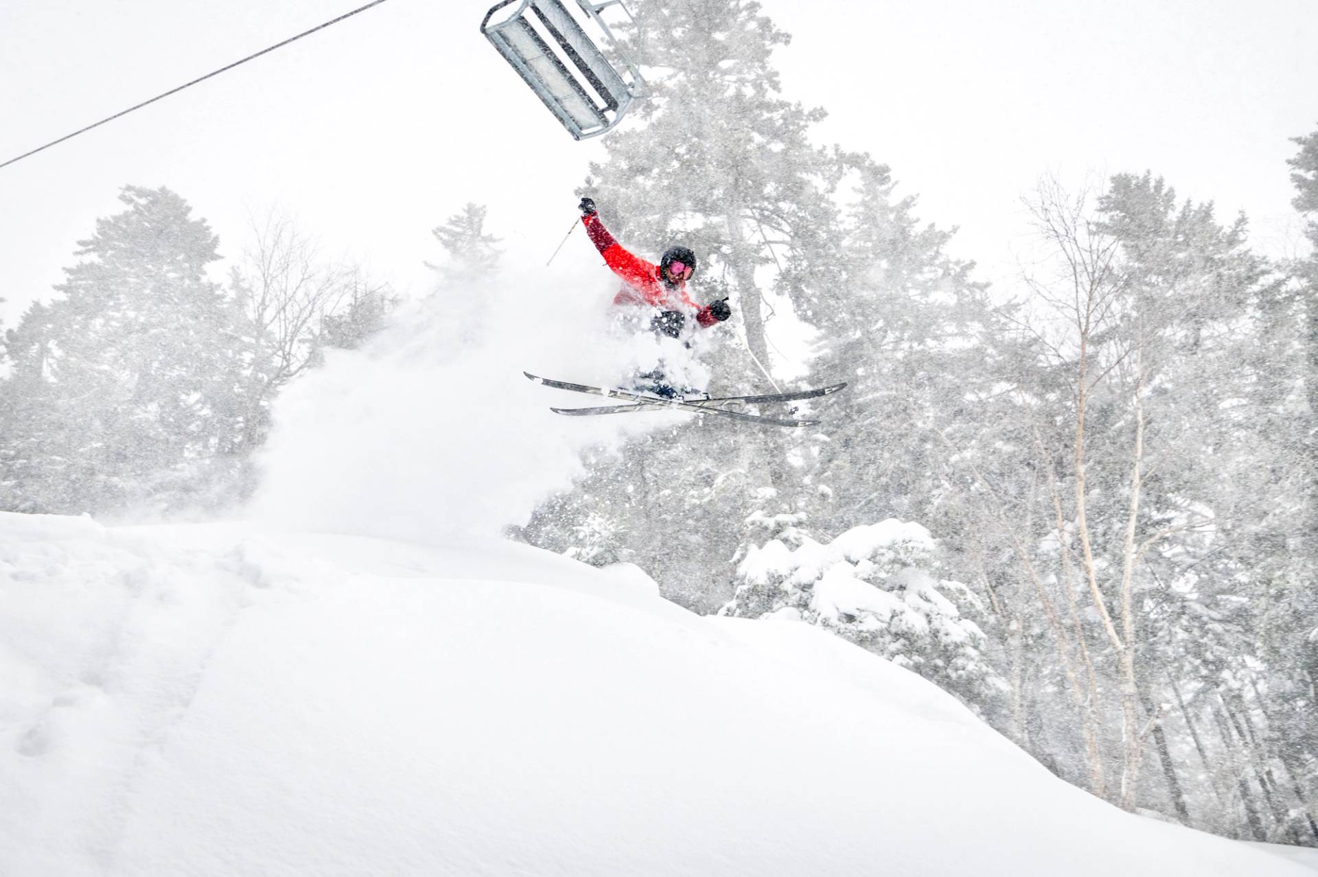 A skier in the air at Sunday River, Maine