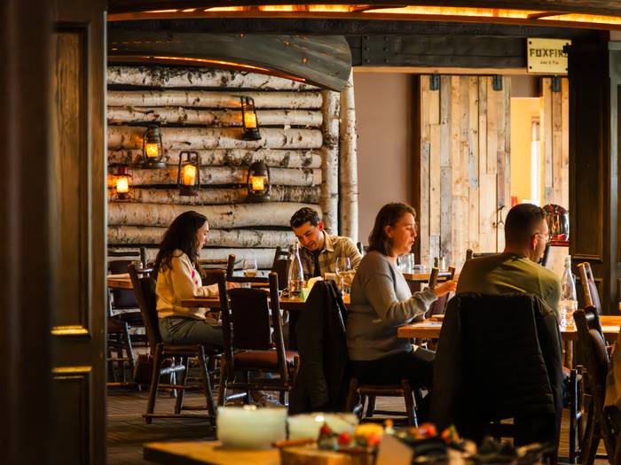 Groups of people enjoying a meal at Camp.
