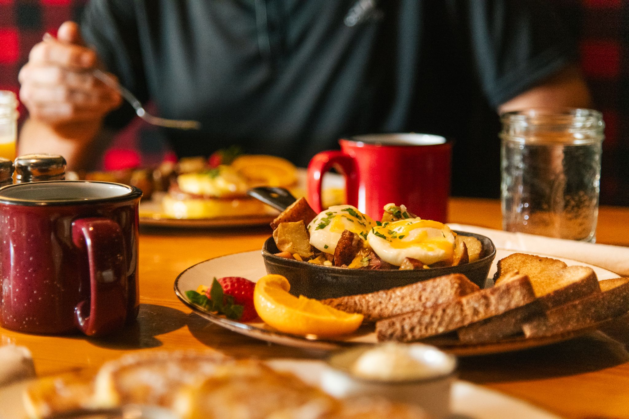 A person enjoying breakfast at Camp at Sunday River.