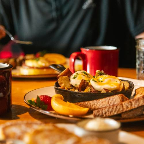 A person enjoying breakfast at Camp at Sunday River.