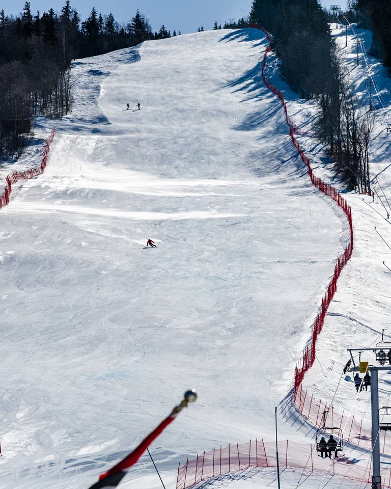A person ski racing at Sunday River.