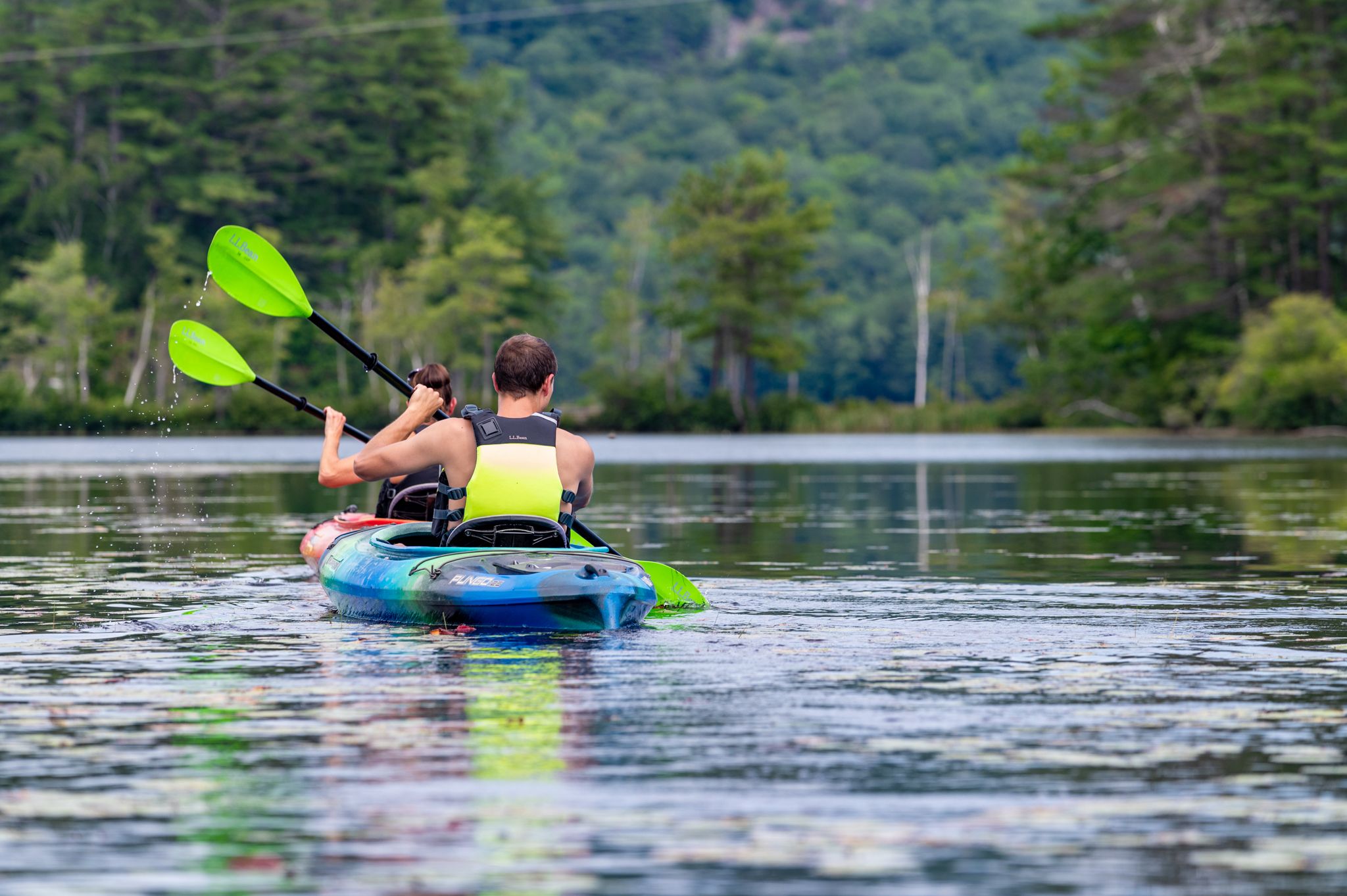 Kayakers participating in Sunday River Outfitters.