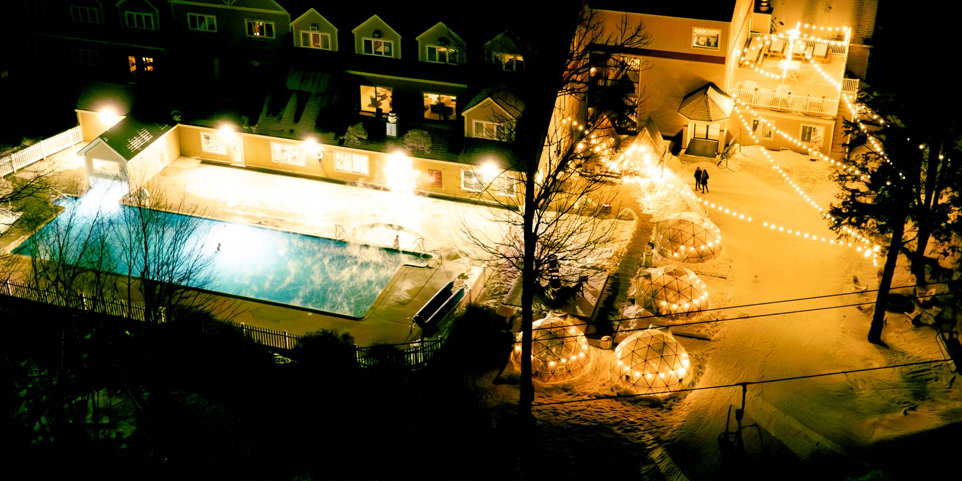 The outside of the Grand Summit Hotel at nighttime at Sunday River.