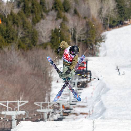 A person doing a trick off a jump at Sunday River's Bust N Burn.