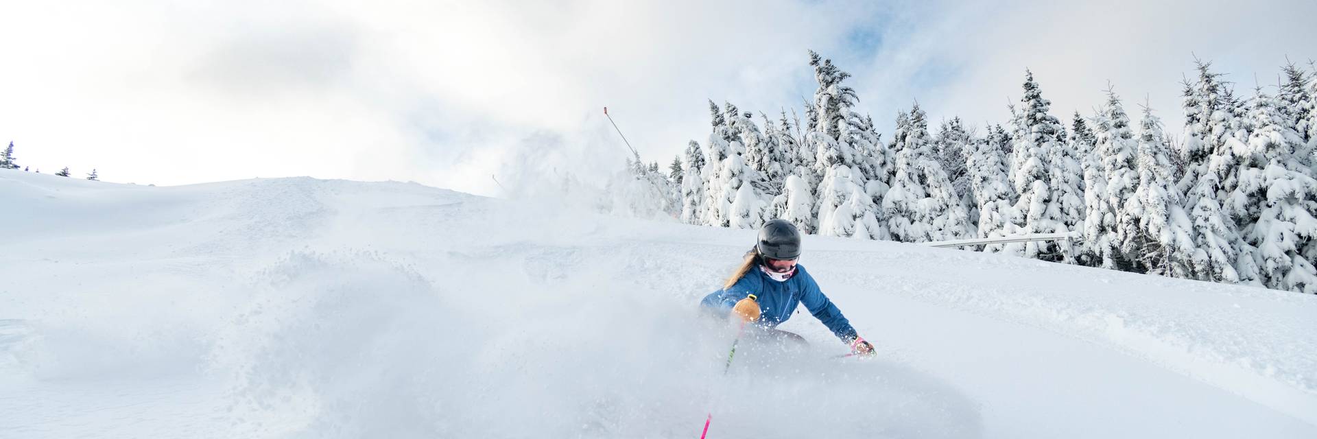 A skier in powder at Sunday River.