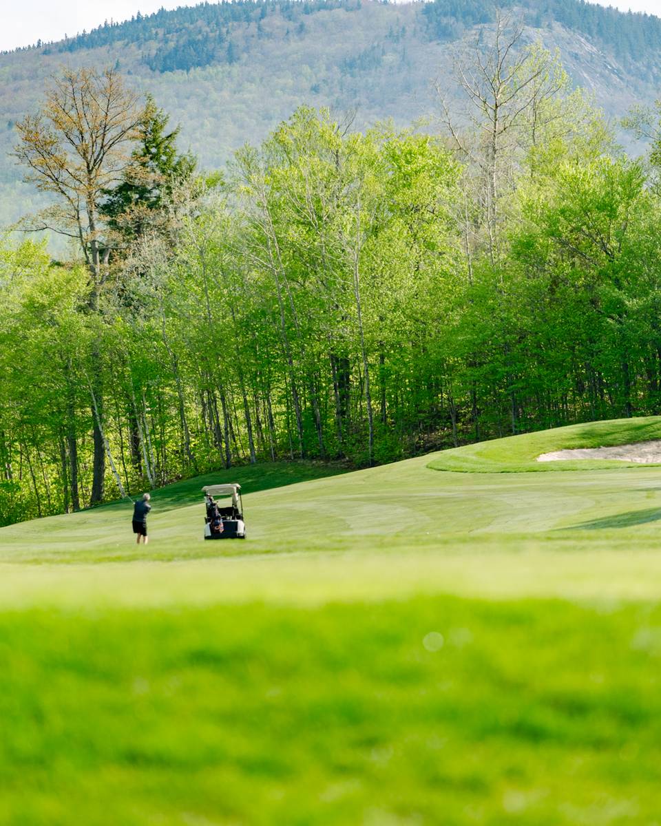 People playing golf at Sunday River.