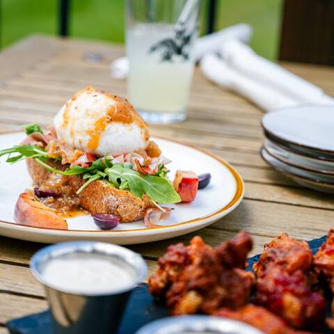 Drinks and food on a table at the Clubhouse.