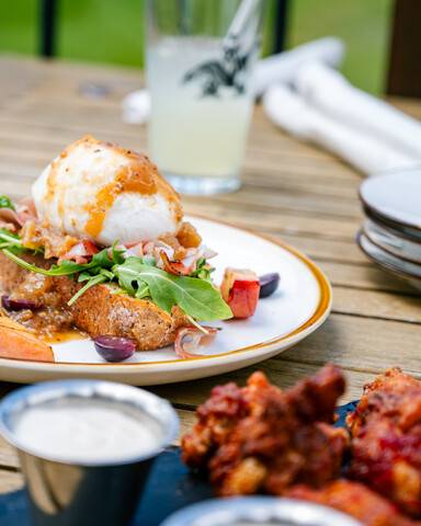 Drinks and food on a table at the Clubhouse.