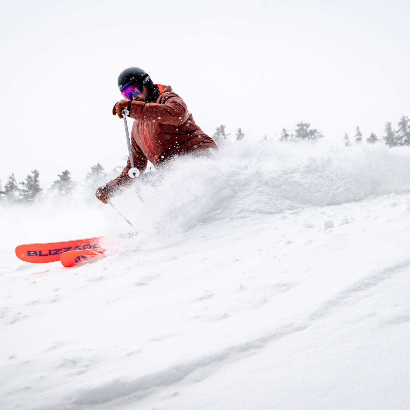 A woman shredding fresh corduroy at Sunday River.
