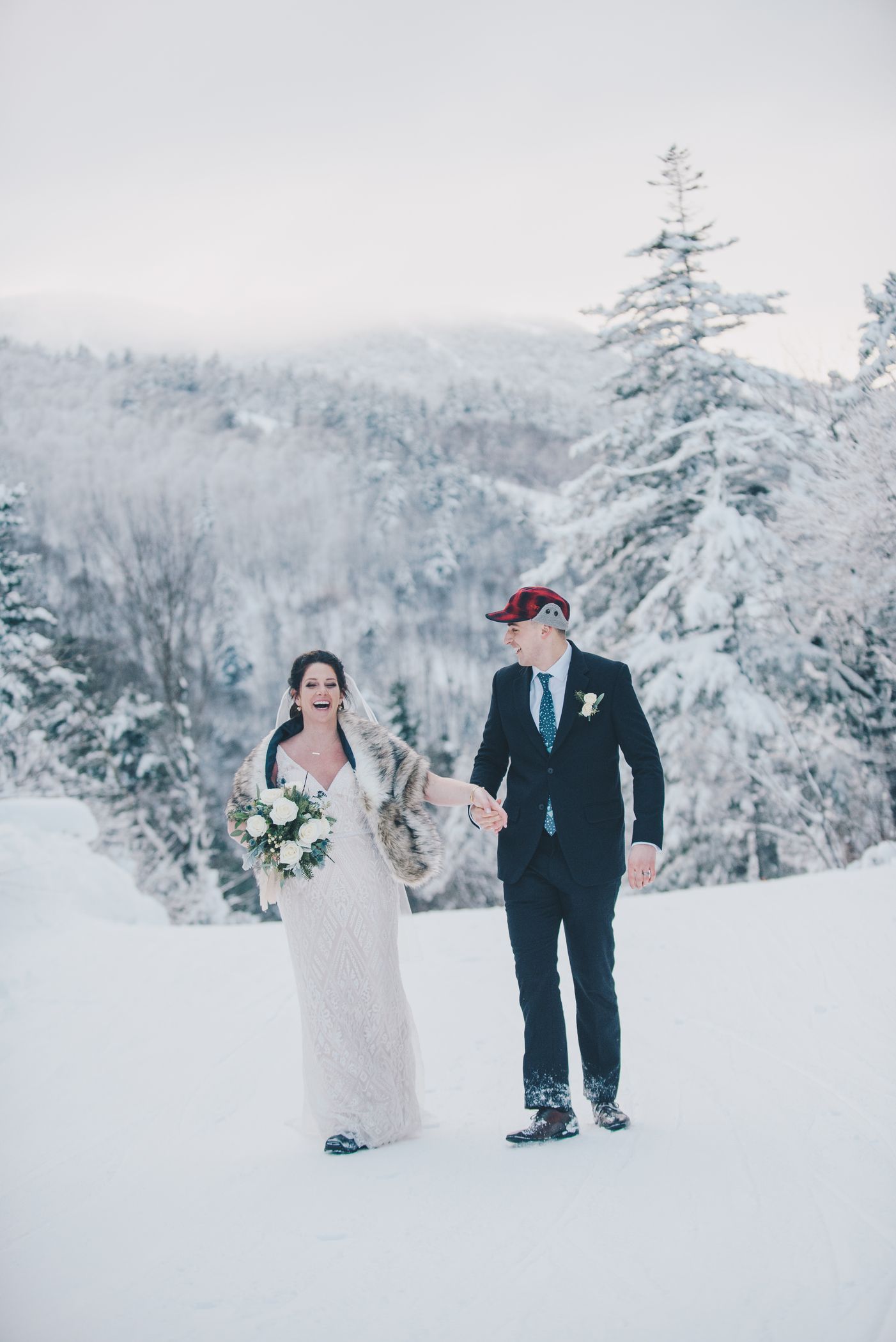 A husband and wife talking in the snow at Sunday River.