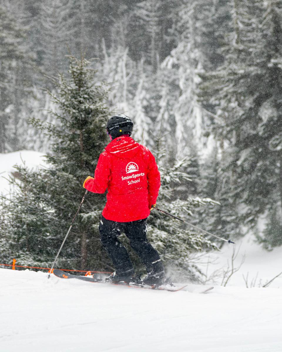 A ski coach teaching an adult at Sunday River.