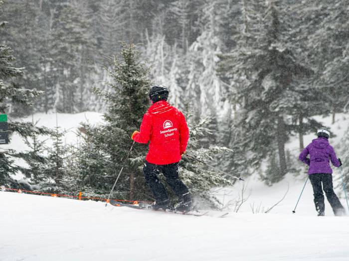 Sunday River SnowSports taking a guest out on a ski lesson.