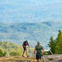 Hikers climbing up a trail at Sunday River.