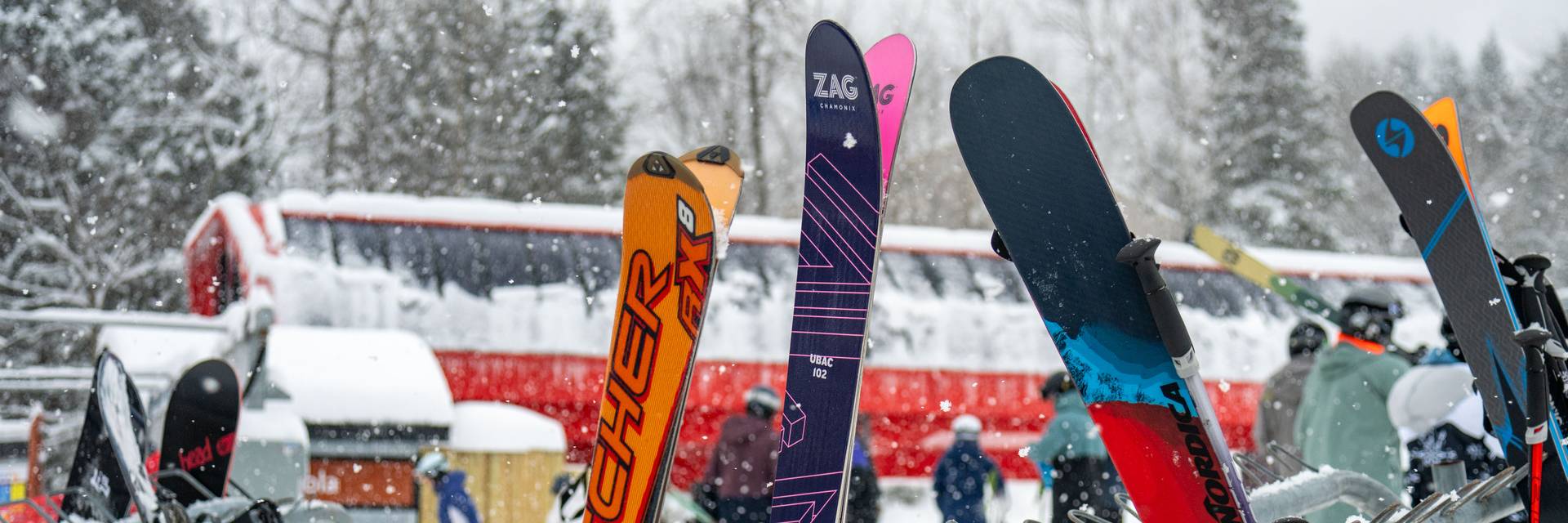 A woman skiing down a trail at Sunday River