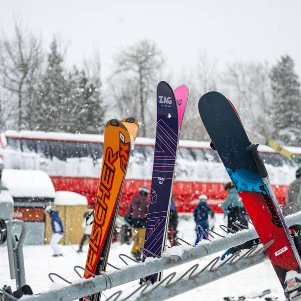 A woman skiing down a trail at Sunday River