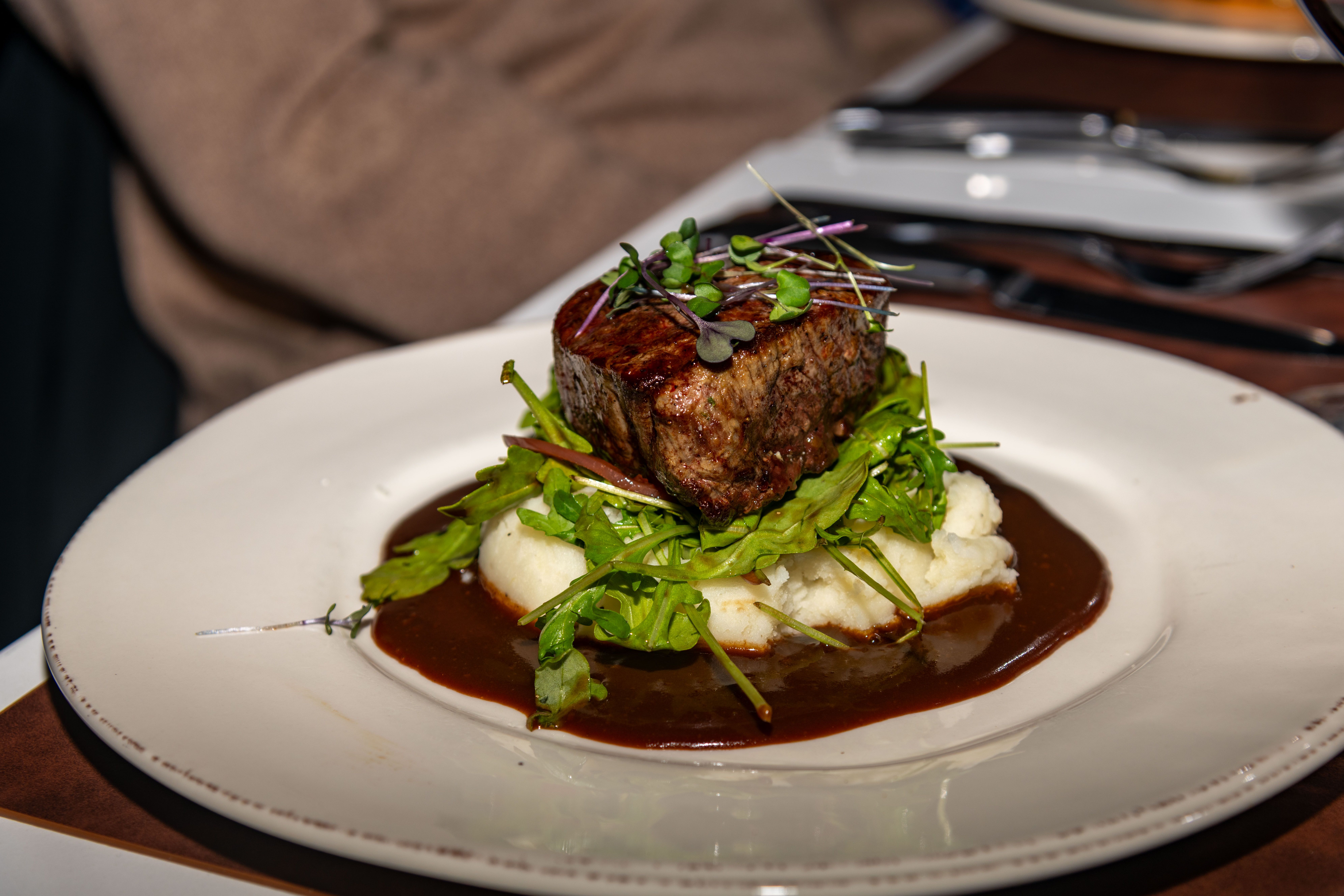A plate of steak and potatoes at Sunday River's Ember.