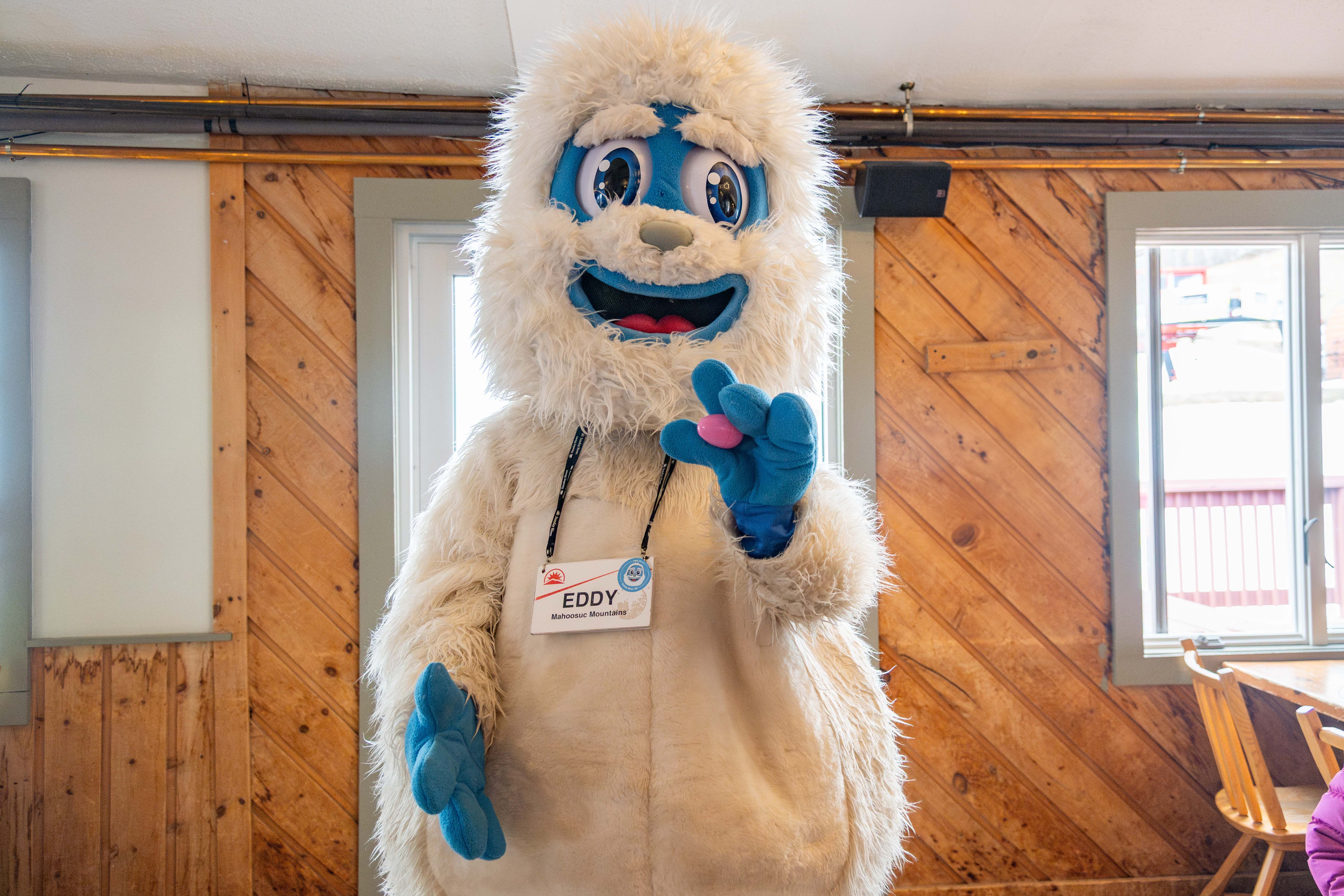 Eddy the Yeti holding an Easter Egg.