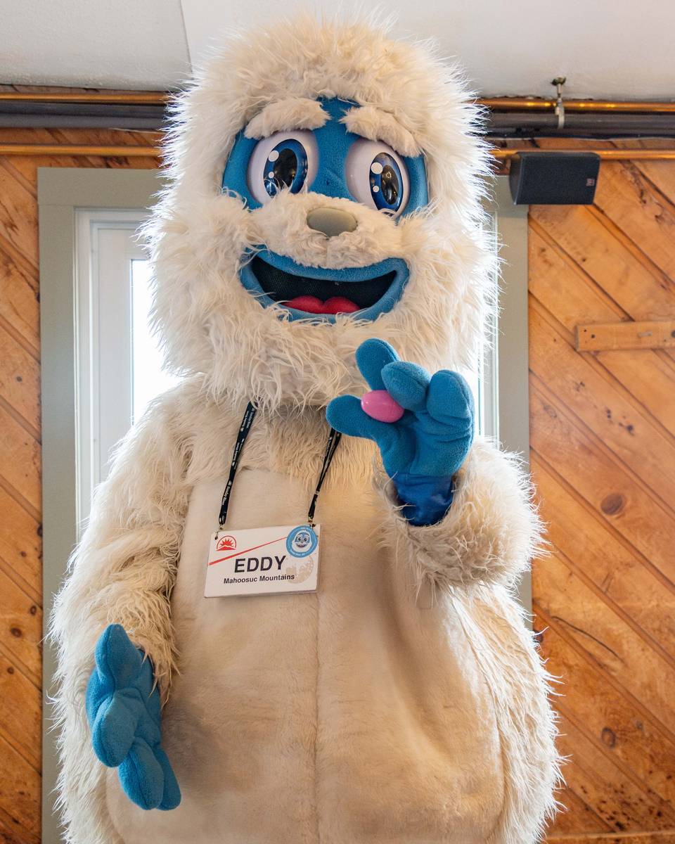 Eddy the Yeti holding an Easter Egg.