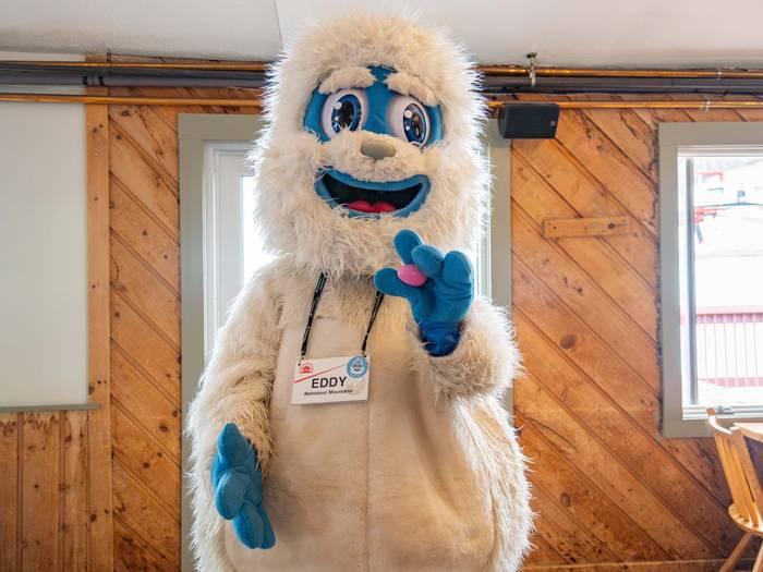 Eddy the Yeti holding an Easter Egg.