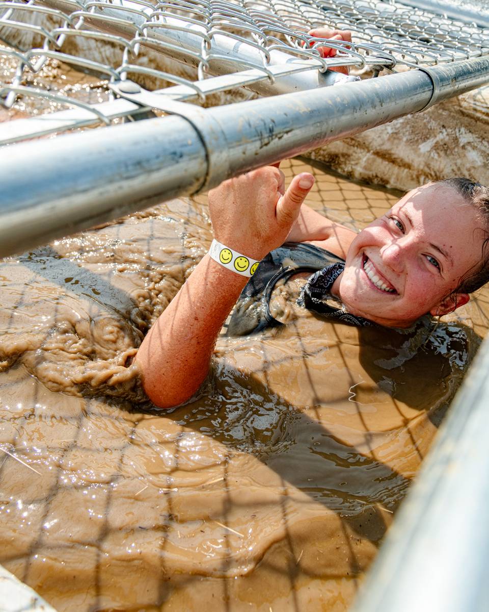 A person smiling through the pain at Sunday River's Tough Mountain Challenge.