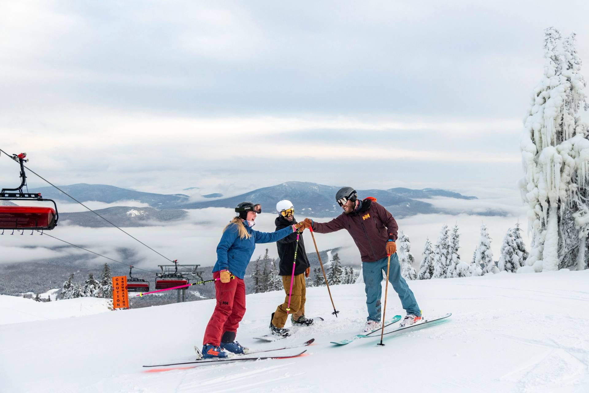 Skier on corduroy with a blue sky.