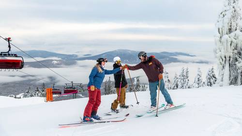 A group of skiers at the top of the Jordan 8