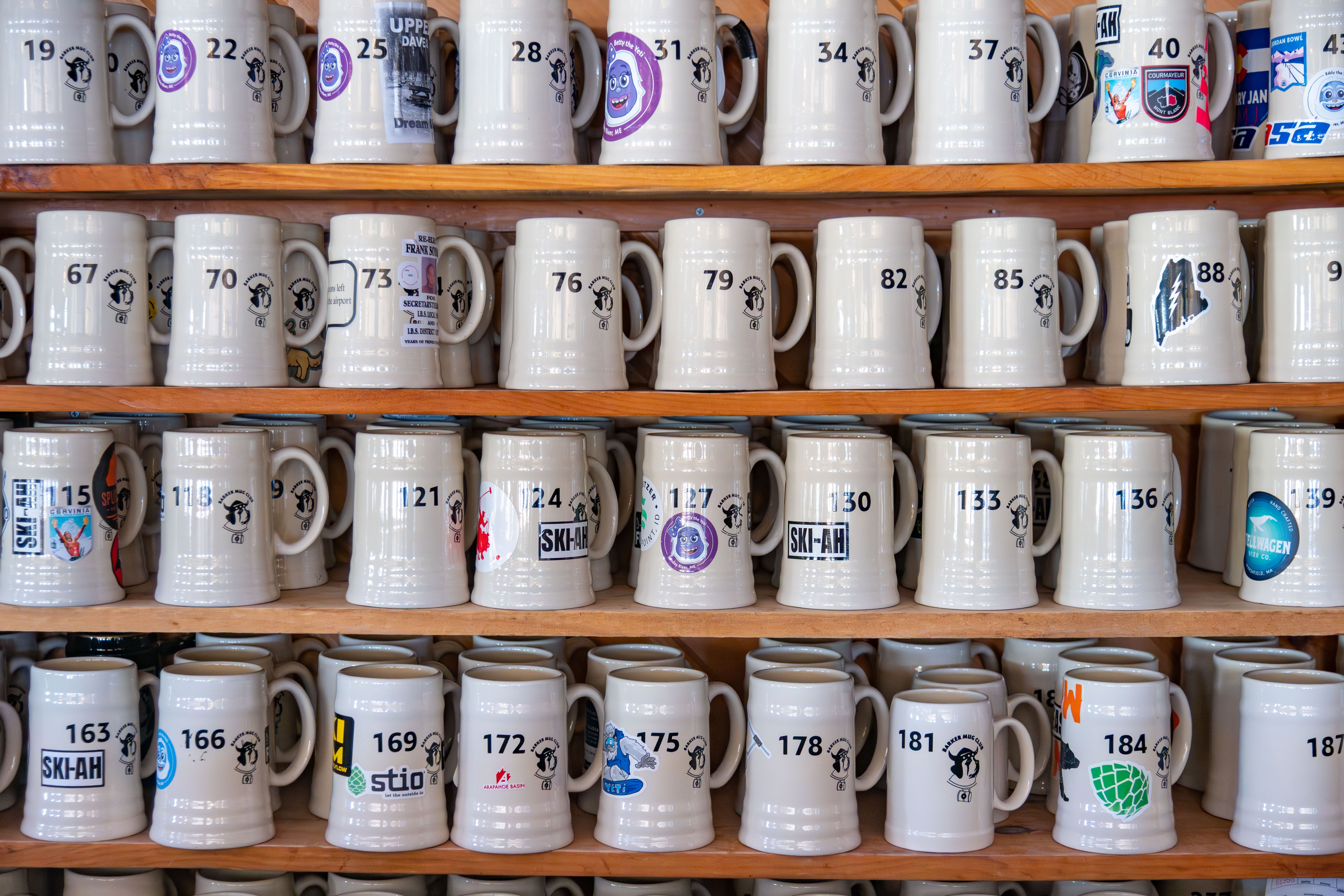 A wall of mugs at Sunday River's Barker Bar.
