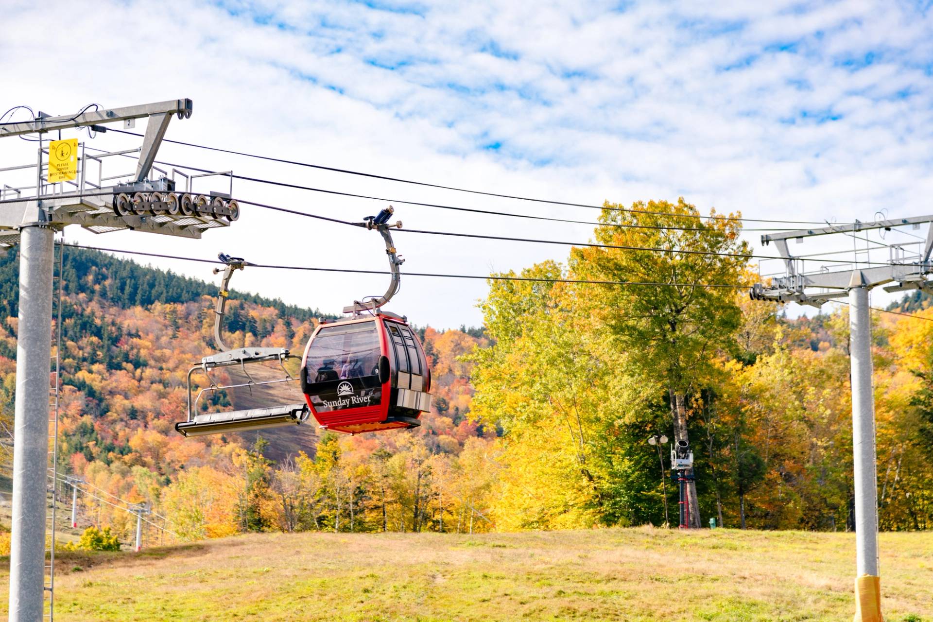 The Chondola at Sunday River spinning over the trees during fall foliage time.
