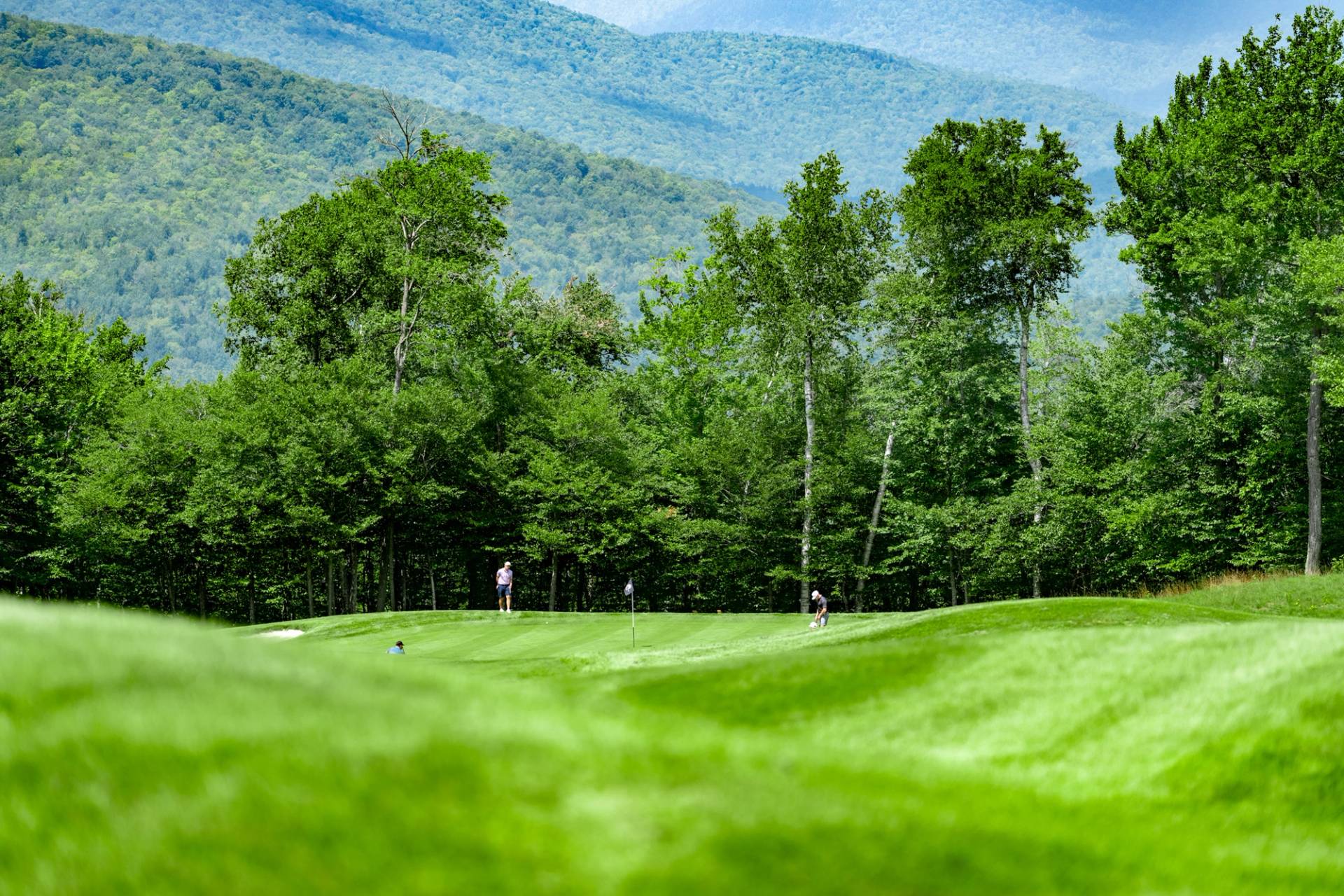 People playing golf at Sunday River.