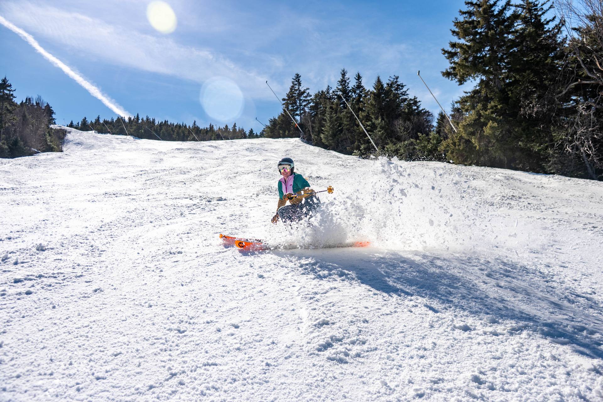 A person skiing in spring at Sunday River.