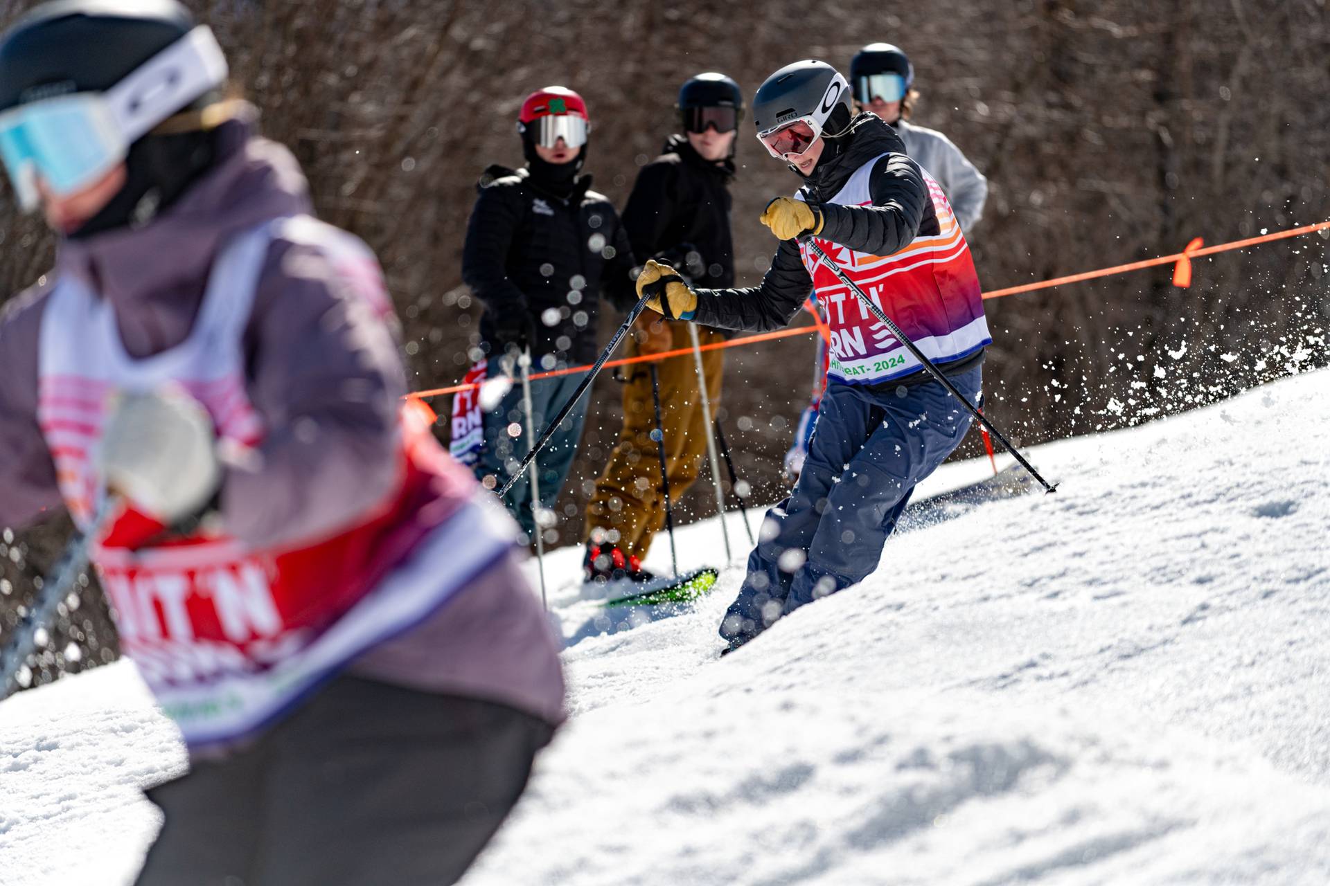Skiers competing in Bust B Burn at Sunday River.