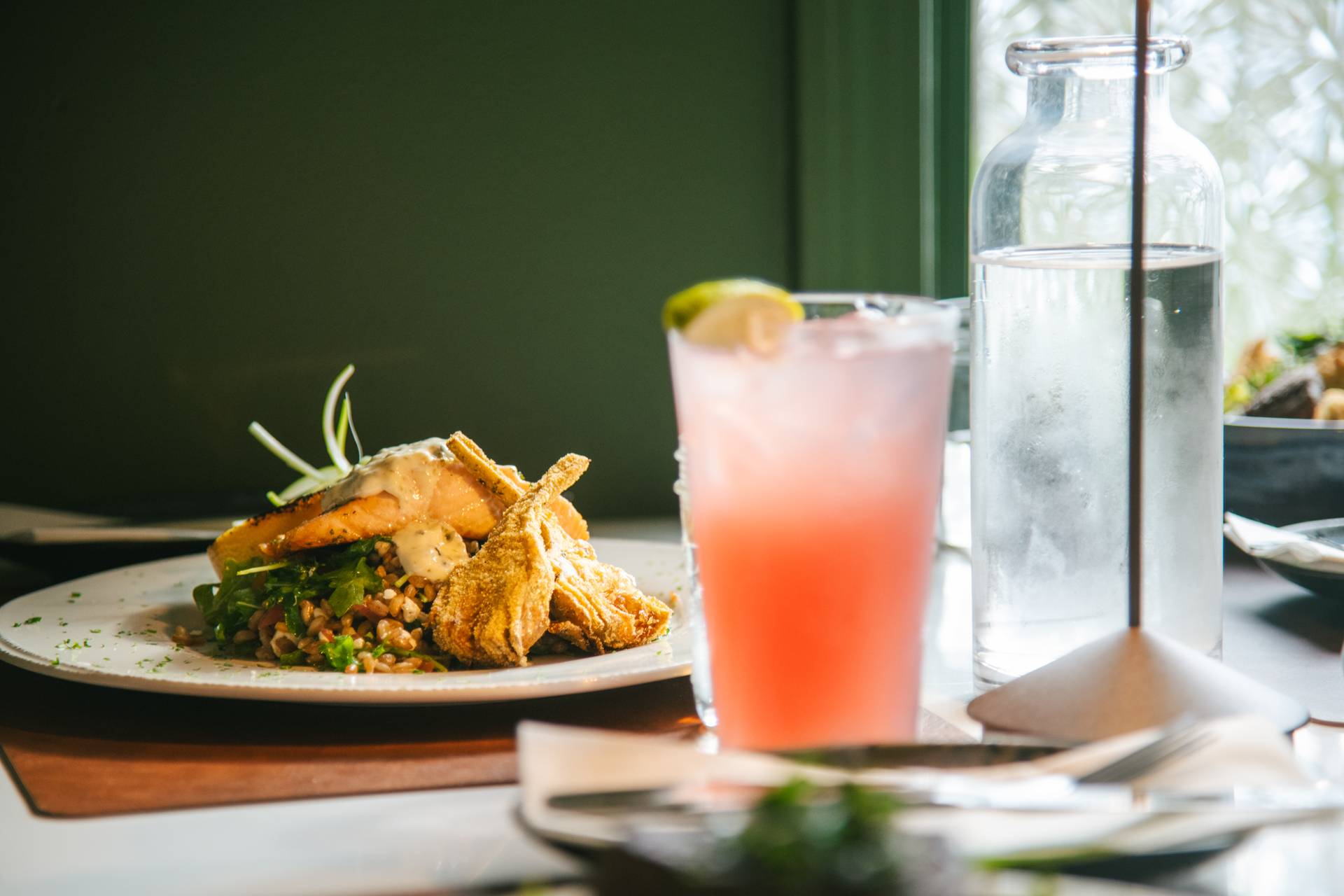 A plate of food with drinks from Ember at Sunday River.