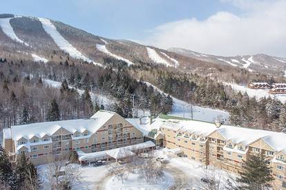 A drone view of the Grand Summit Hotel in the winter time.