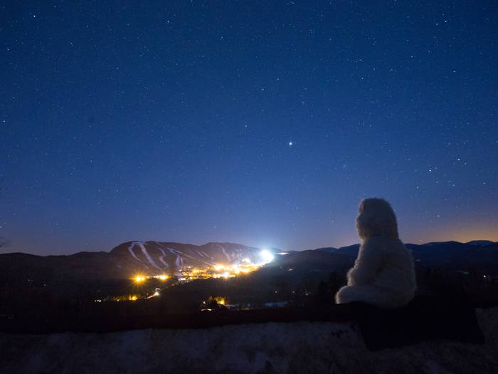 Eddy the Yeti looking at Sunday River at night.