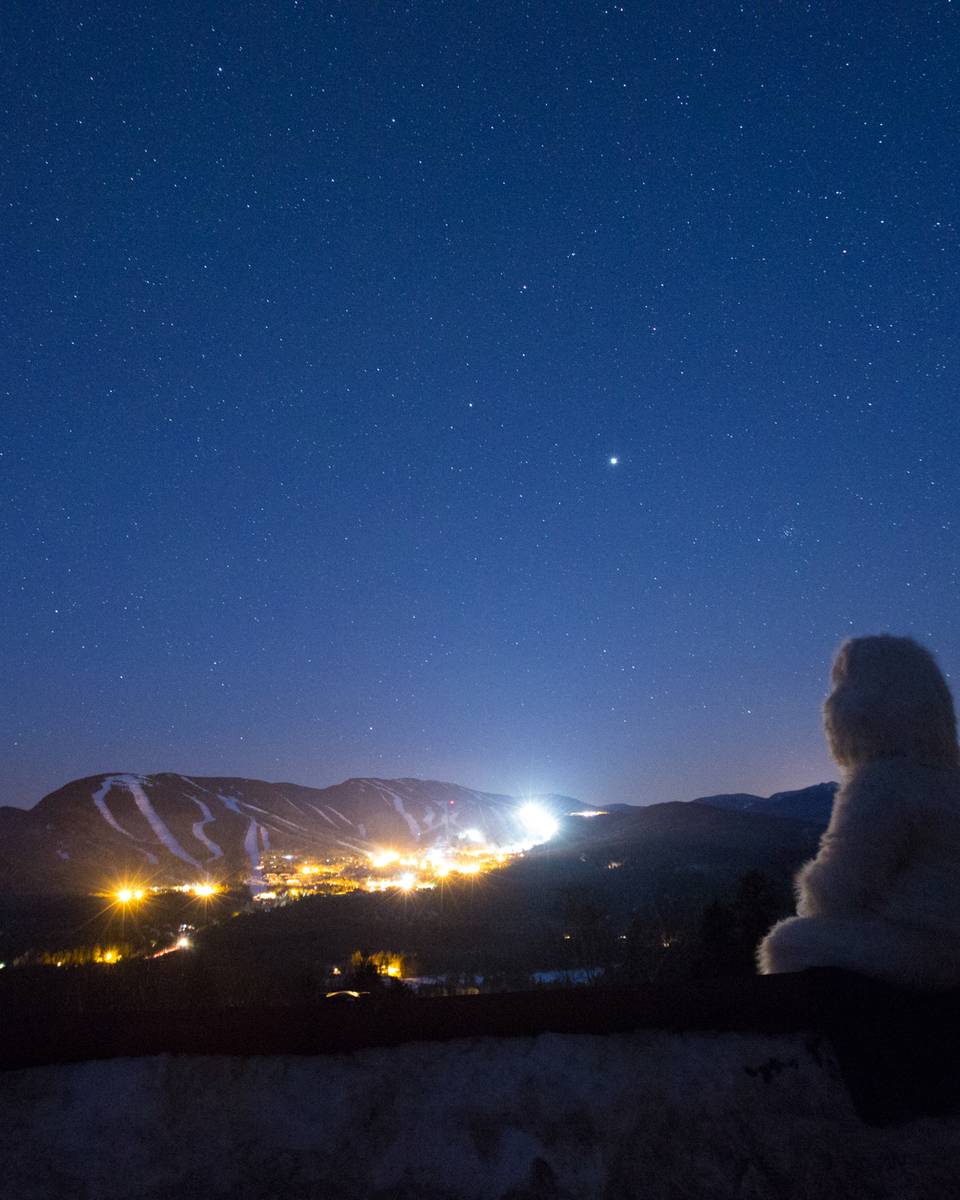 Eddy the Yeti looking at Sunday River at night.