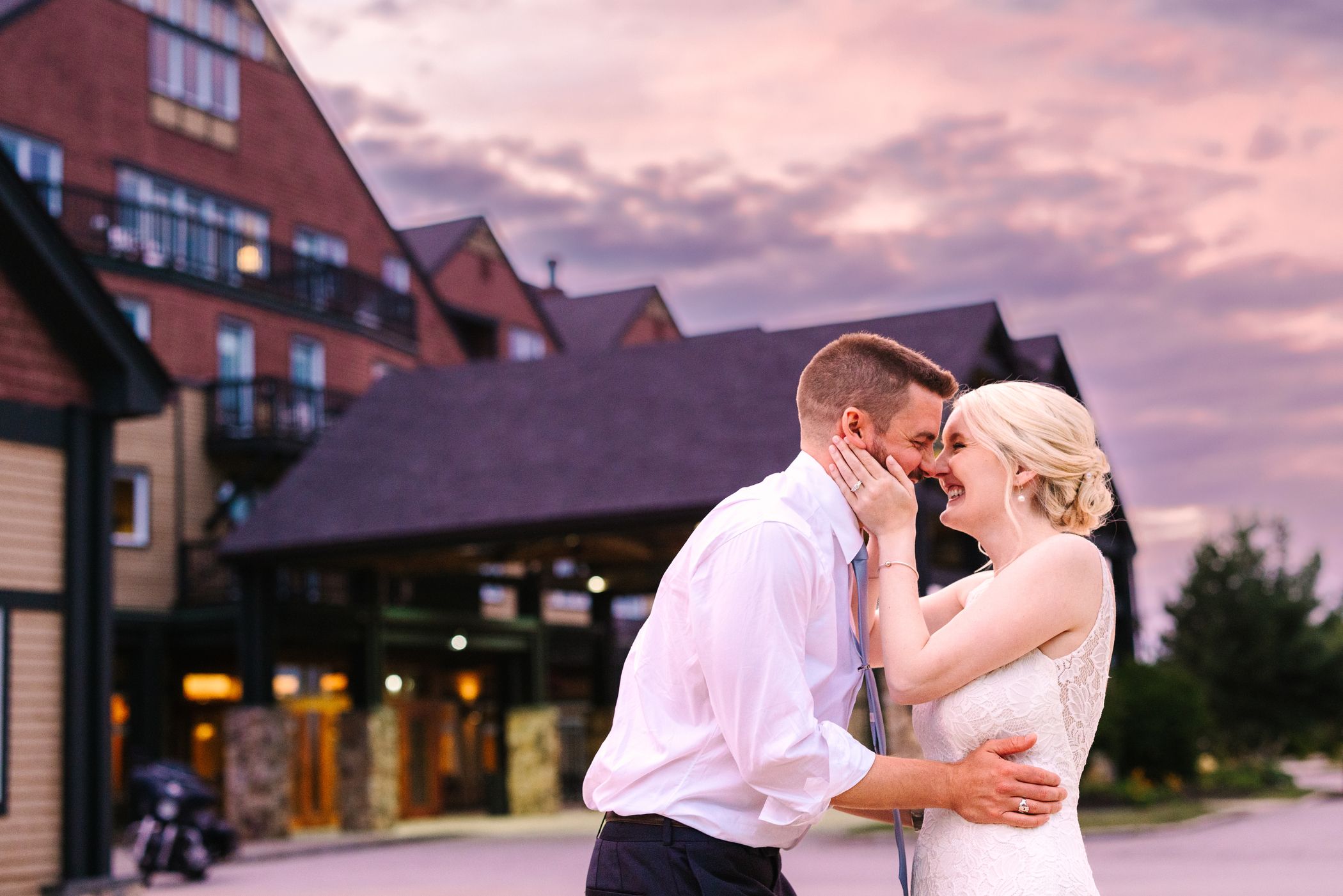 A couple posing for a picture on their wedding day.