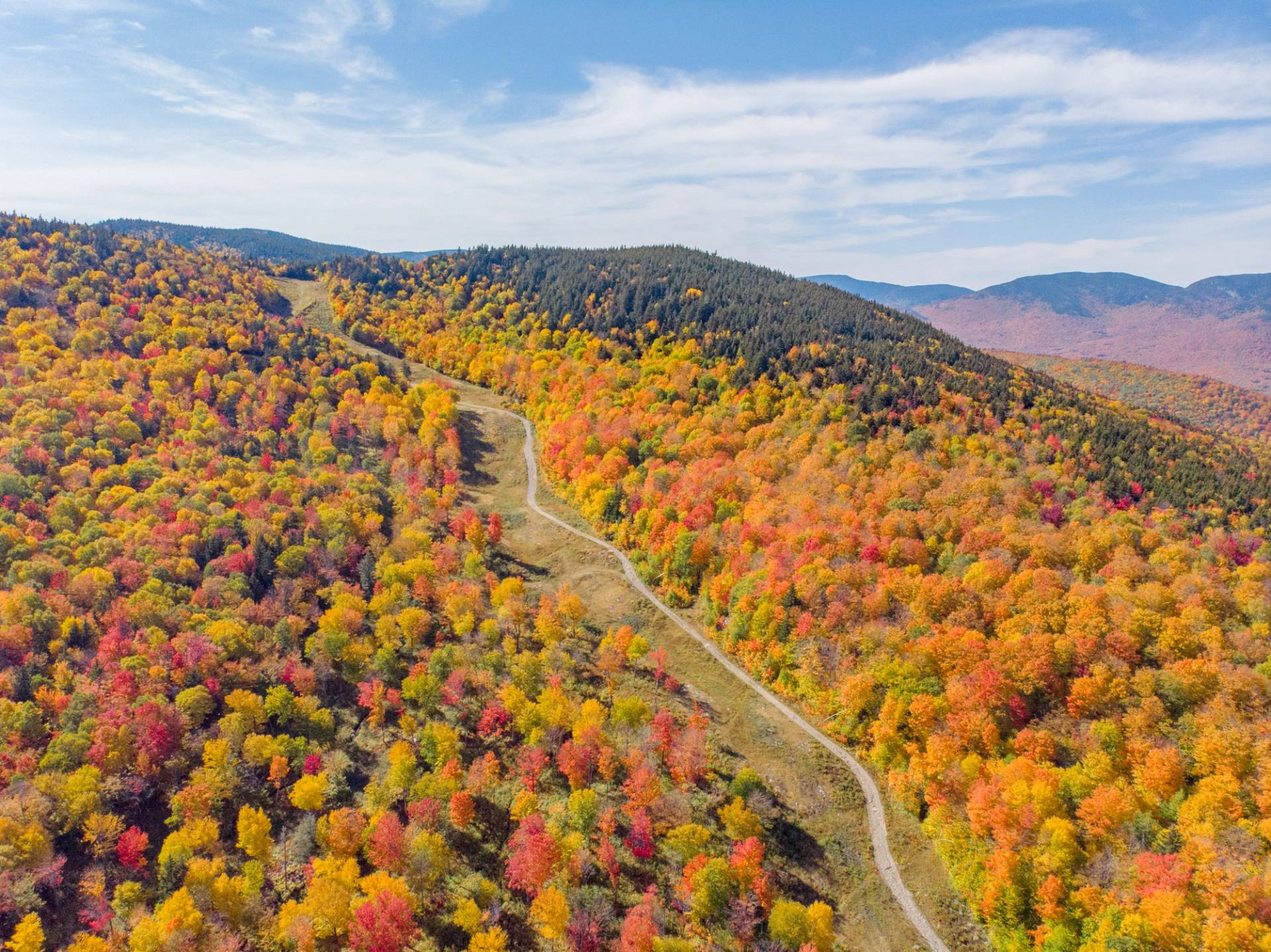 A fall scene at Sunday River with the Chondola cabins running.  