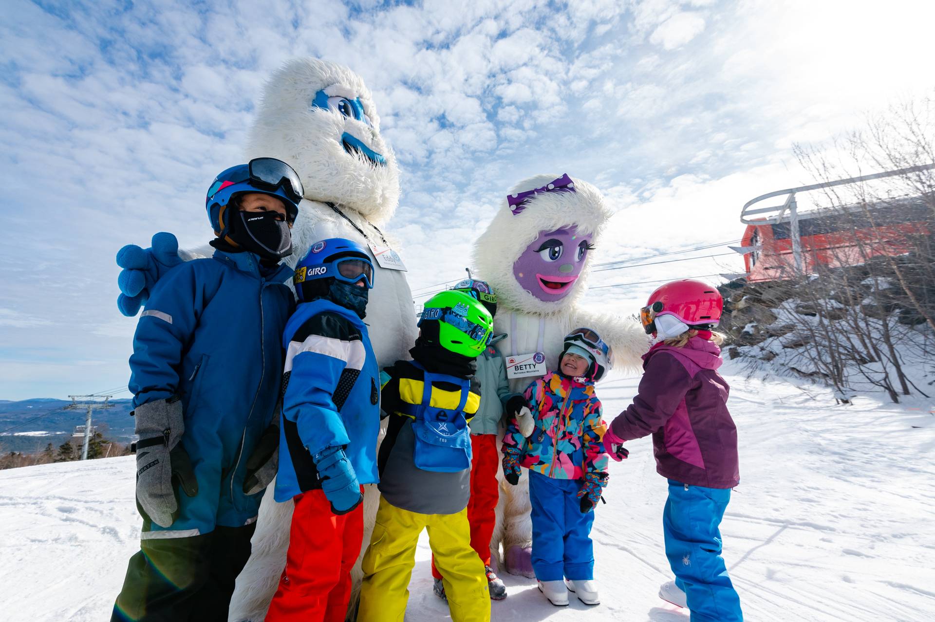 Kids posing for a photo with Eddy and Betty at Sunday River.