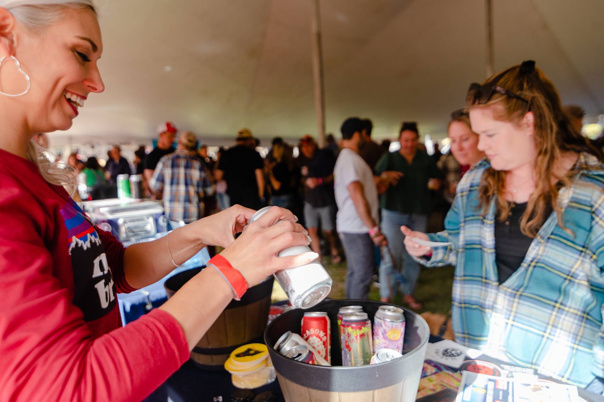 A brewer pouring a drink for a guest at the Maine Brew Fest at Sunday River.