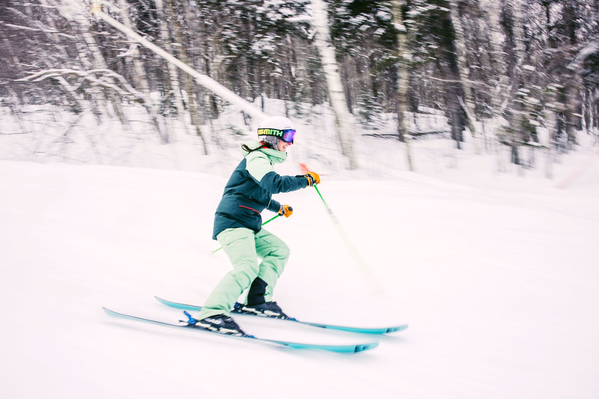 A kid skiing down a trail at Sunday River. 