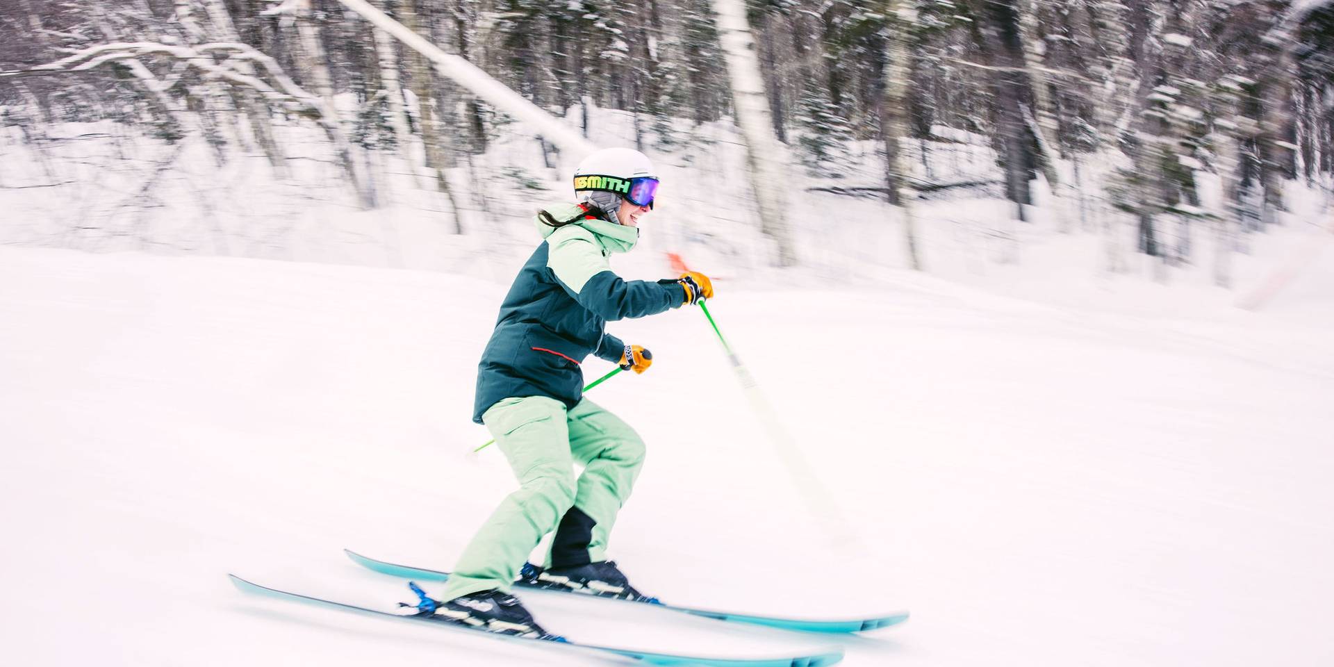A kid skiing down a trail at Sunday River.