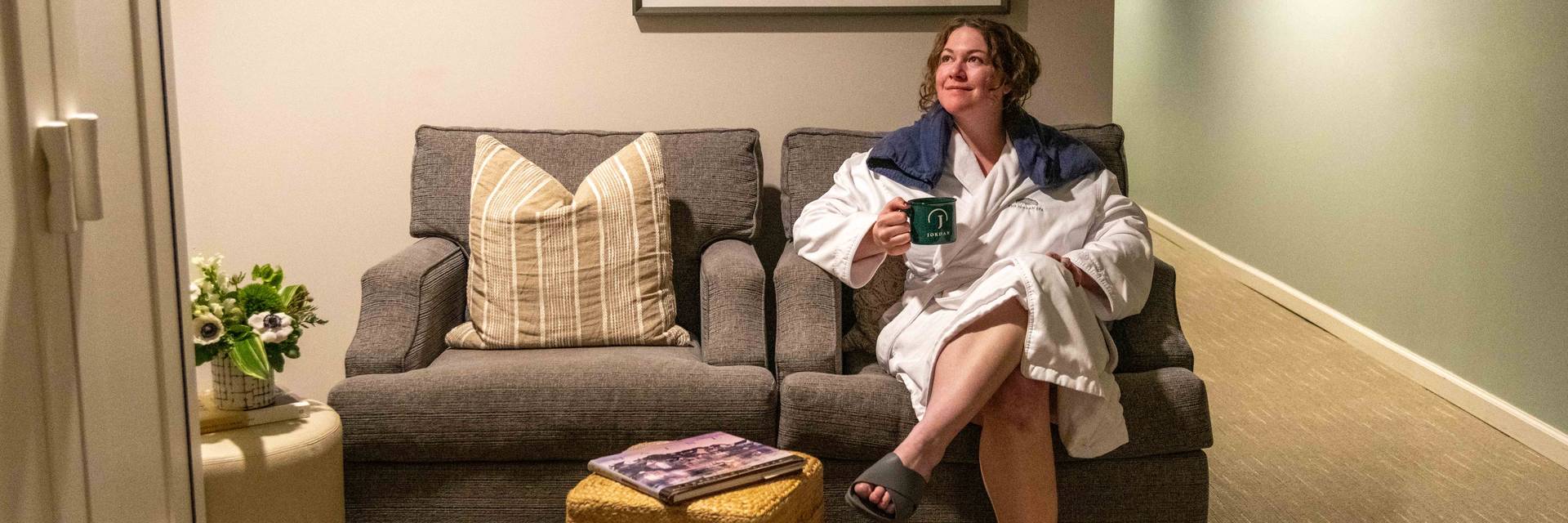 A woman relaxing inside the Jordan Spa at Sunday River.