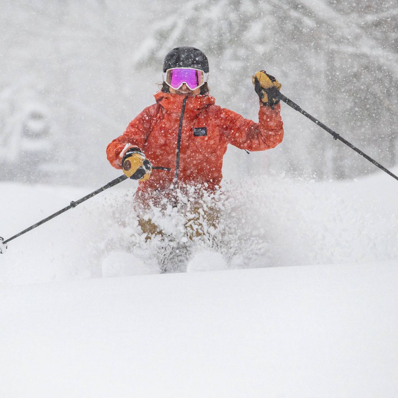 A skier going down a trail in fresh powder at Sunday River Resort.