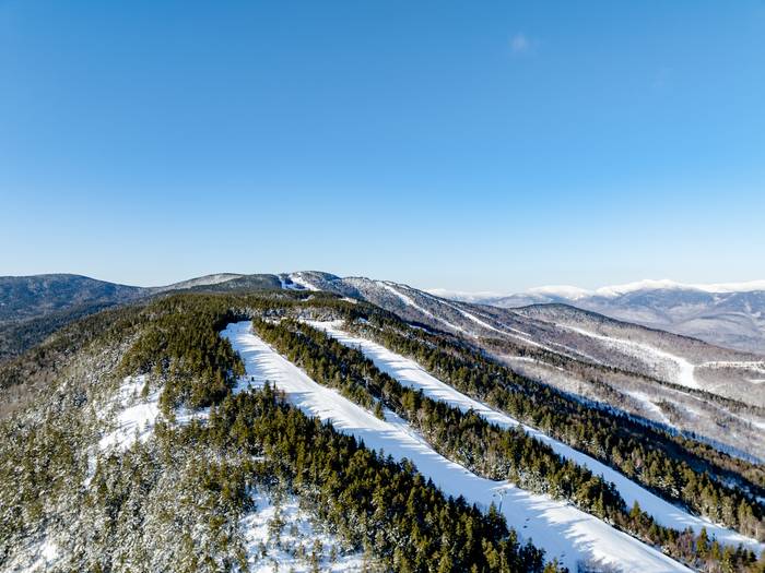 Spruce Peak with skiers and riders in the winter at Sunday River.