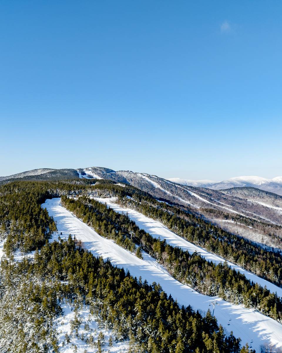 Spruce Peak with skiers and riders in the winter at Sunday River.