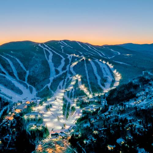 Twilight skiing trails with lights at Sunday River in the evening.