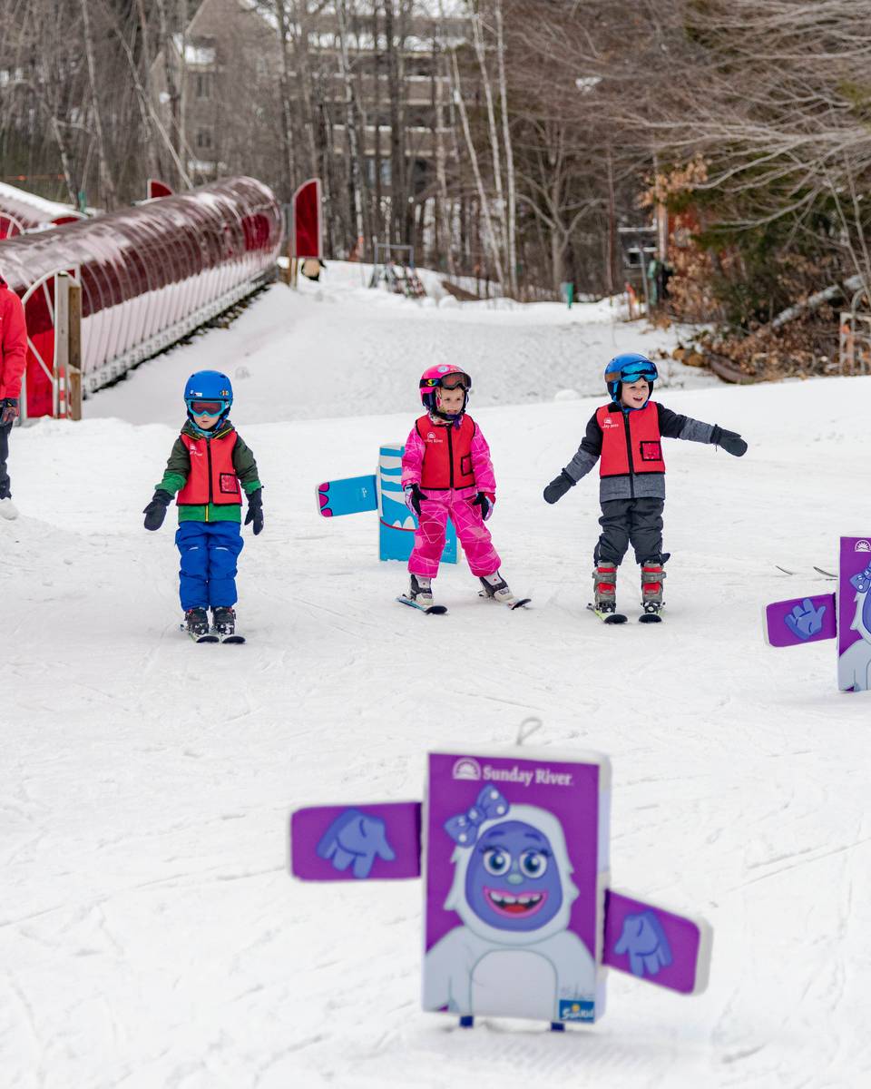 Kids at their lesson, by the magic carpets, at Sunday River.