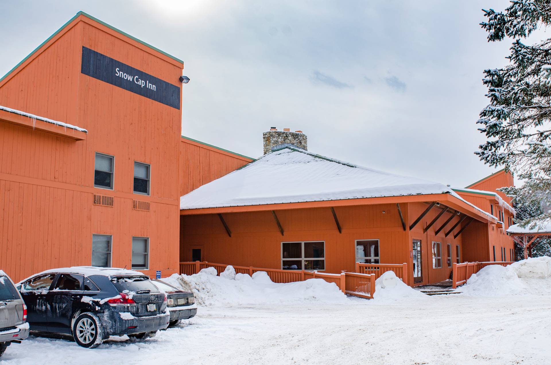 The Snow Cap Inn with snow on the roof.