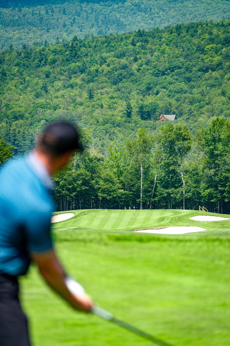 Golfer looking at their shot at Sunday River Golf Club.